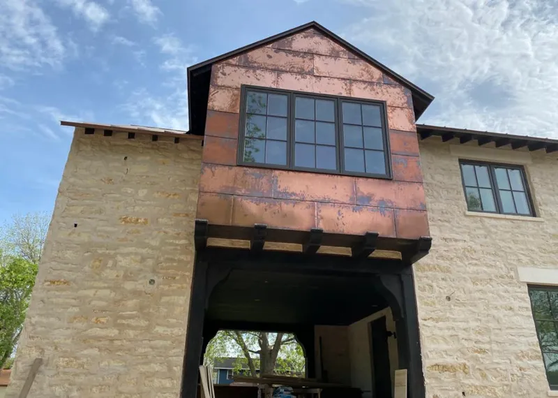 Copper metal panel facade on a stone building for Metal Roof Coating in Hialeah